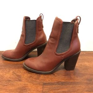 Burgundy colored heeled boots